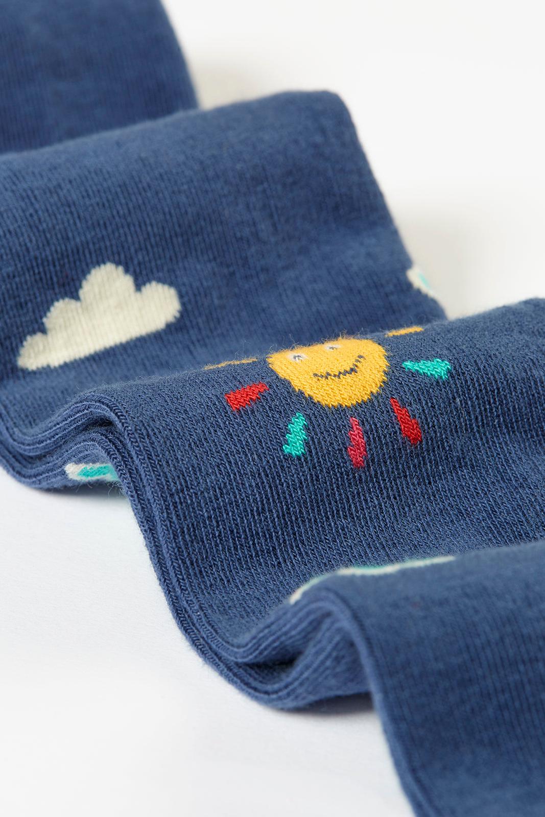 Frugi tights with a sun and cloud design on a white background