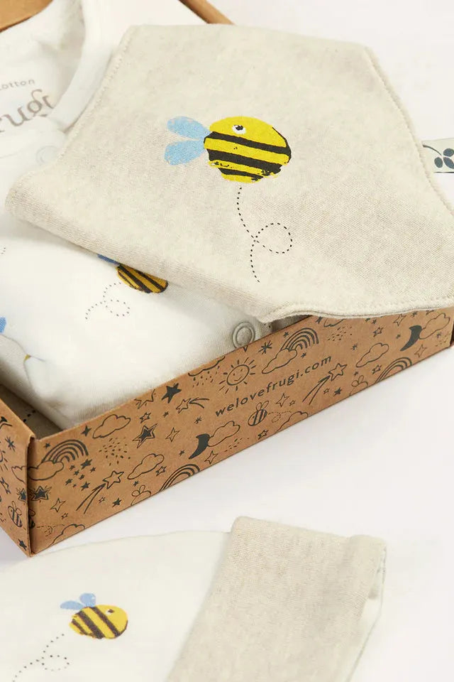 Frugi organic cotton baby bib and clothing set with bee print inside a decorative box