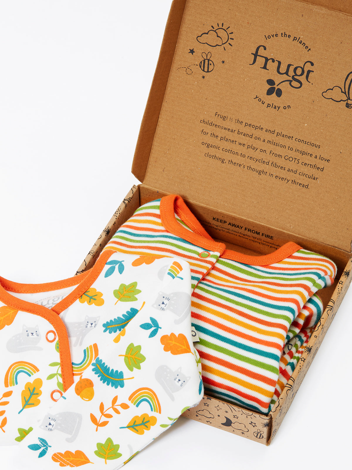 Frugi organic cotton babygro gift set with striped and cat-patterned baby clothes in a branded box.