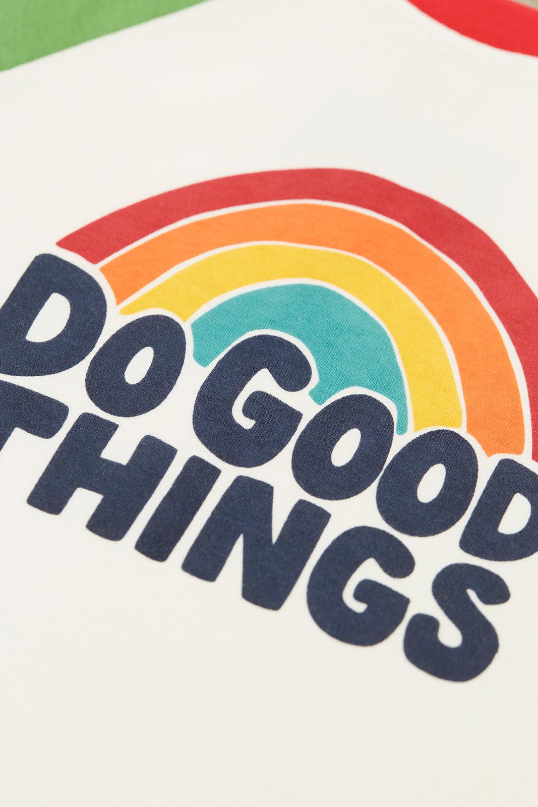 Close up of a Frugi organic cotton top featuring a colourful rainbow print and the text Do Good Things.