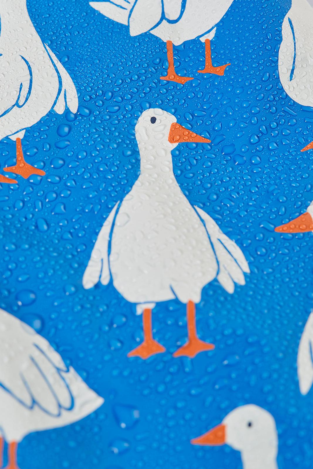 Pattern of white geese with orange feet on a blue background