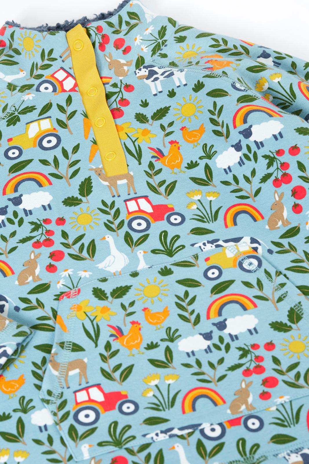 Kids fleece with colourful pattern of animals, vehicles, and nature elements on a blue background.