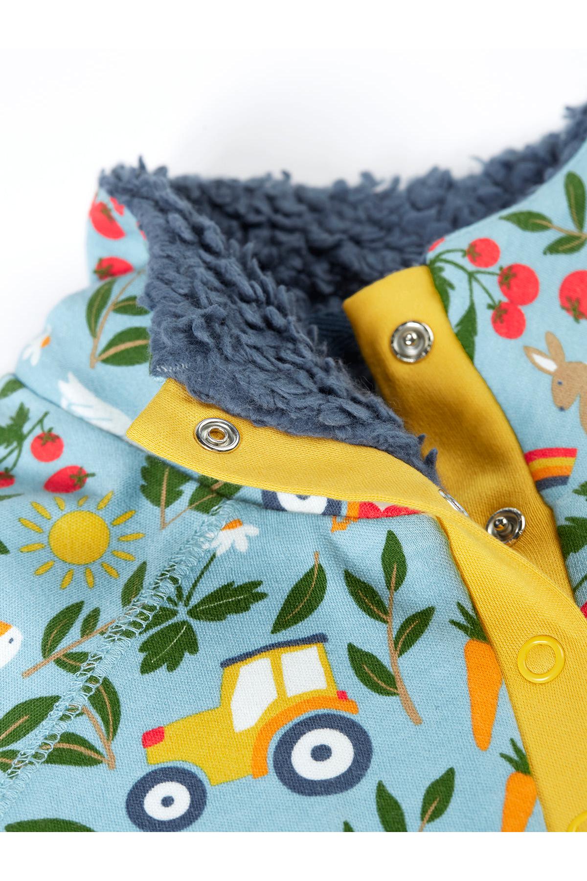Children's organic cotton fleece with a blue floral pattern and yellow accents on a white background
