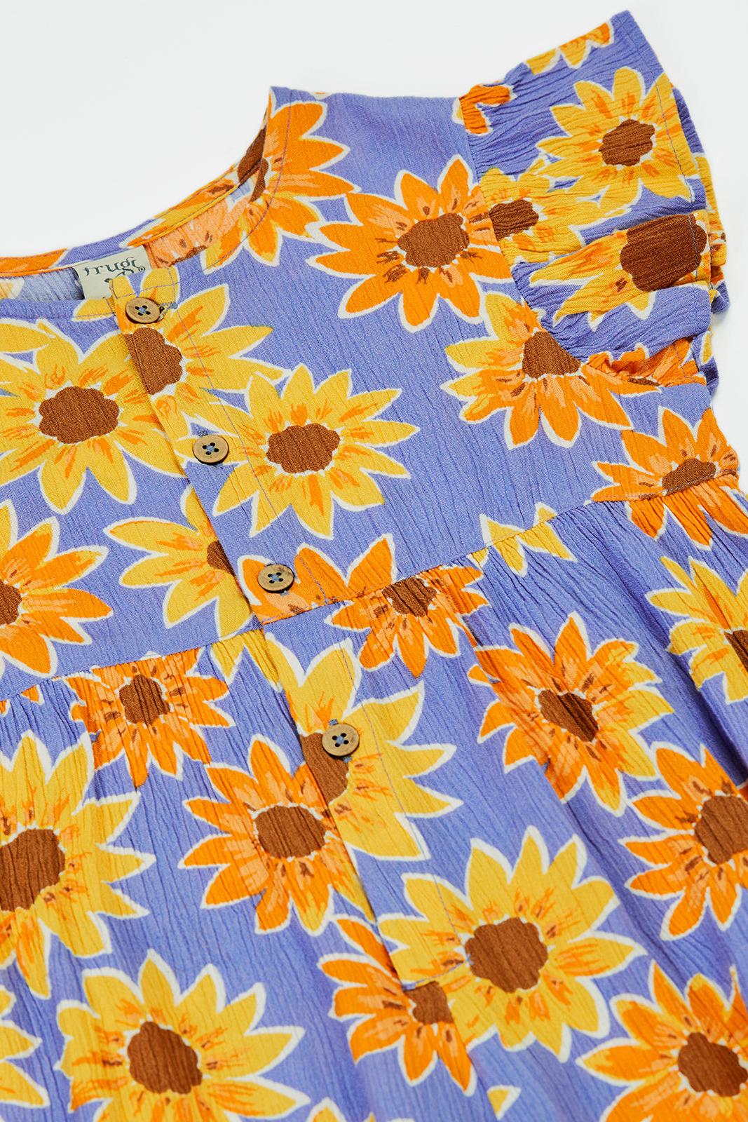 Frugi children's jumpsuit featuring a vibrant purple fabric with a yellow sunflower pattern and button-down front.