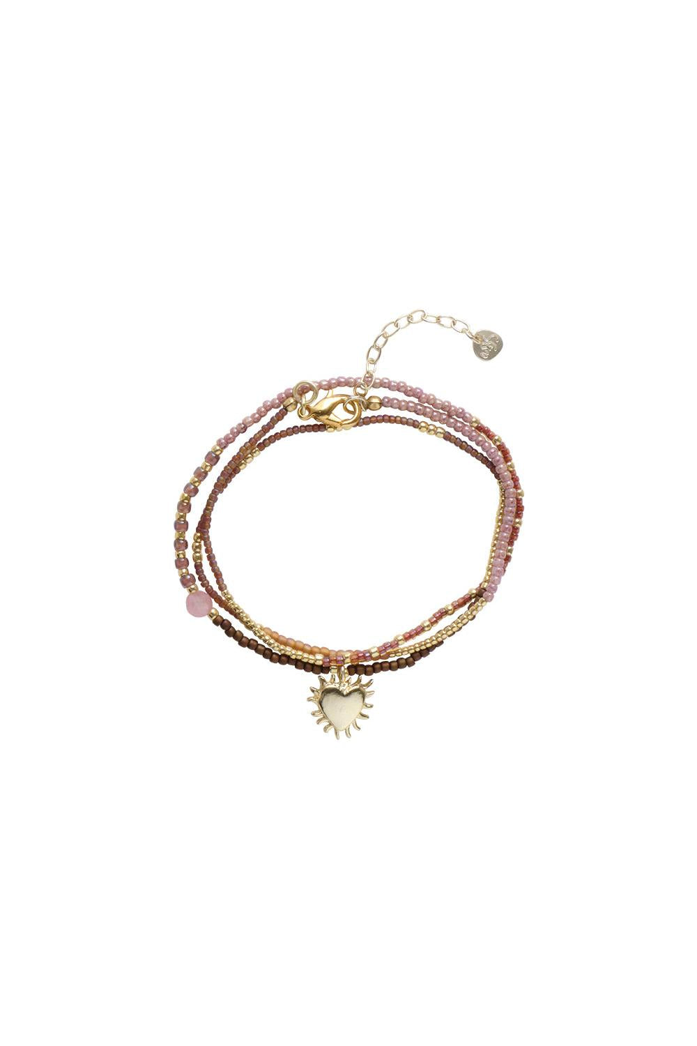 Multistrand gold heart necklace with pink rose quartz and assorted beads by A Beautiful Story.
