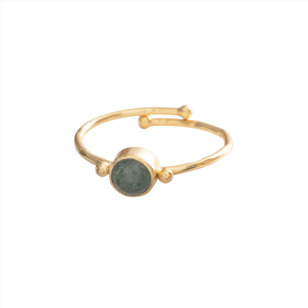 A delicate gold ring featuring a smooth, round green aventurine gemstone, isolated on a white background.
