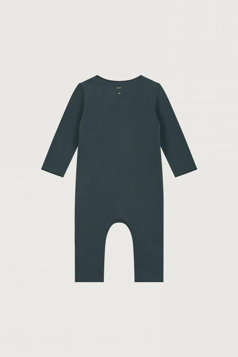 A dark slate blue long-sleeve baby romper with a footless crotch, shown flat against a light gray background.