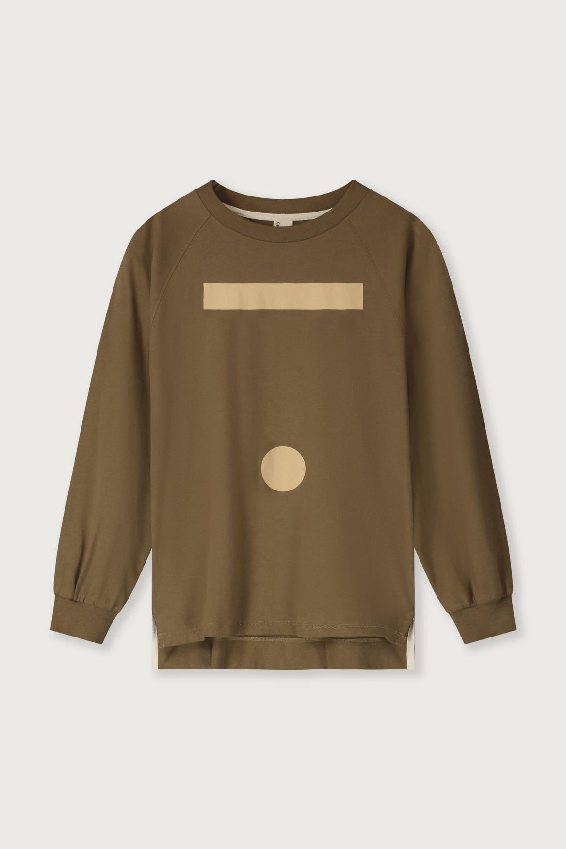 A long-sleeve crewneck sweatshirt in brown with a beige horizontal bar and a beige circle graphic on the front, displayed against a light gray background.