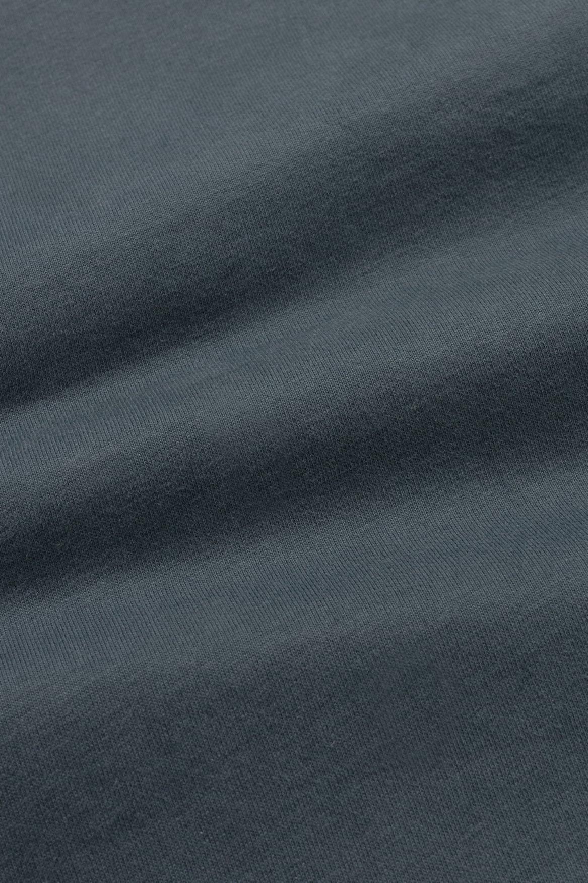 Close-up of dark gray fabric with visible texture