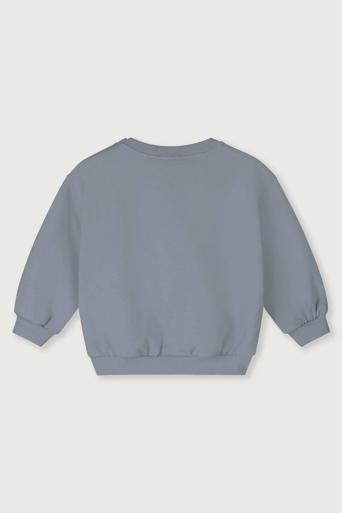 Blue organic cotton sweatshirt on a light gray background