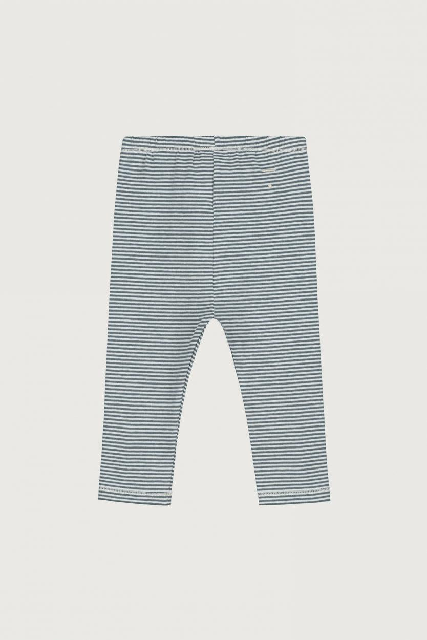 A pair of children's leggings with thin horizontal blue and white stripes, laid flat against a light gray background.
