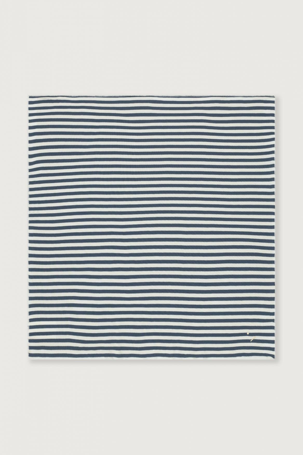 A square fabric item, likely a blanket or towel, featuring a horizontal navy blue and white stripe pattern, displayed flat against a light gray background.