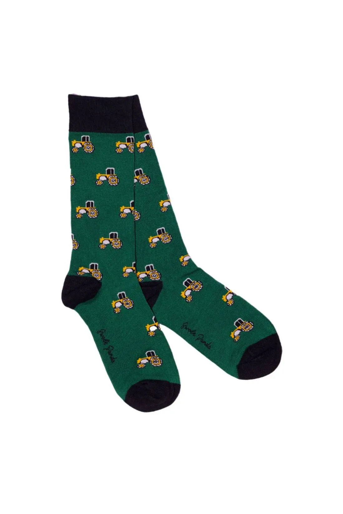 Pair of green crew socks featuring a yellow tractor pattern made from bamboo fiber.