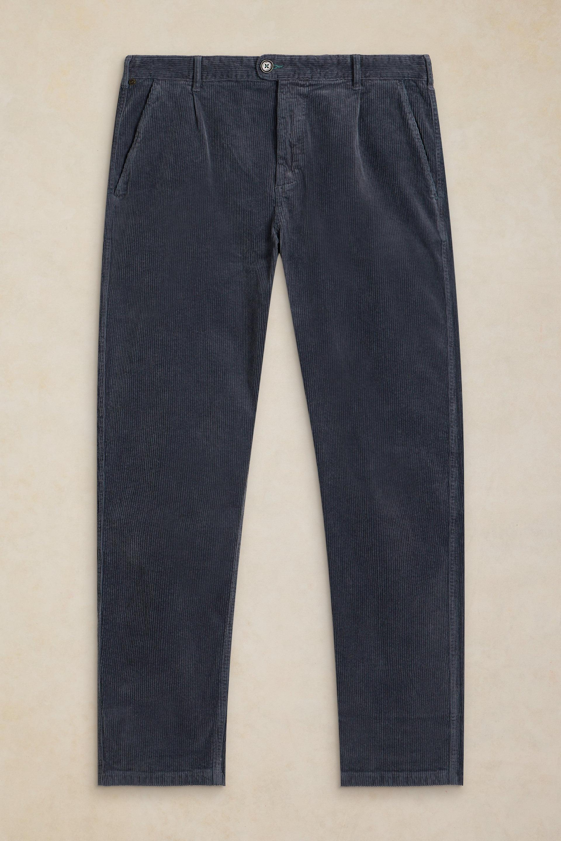 Dark charcoal gray corduroy trousers laid flat against a light beige background.