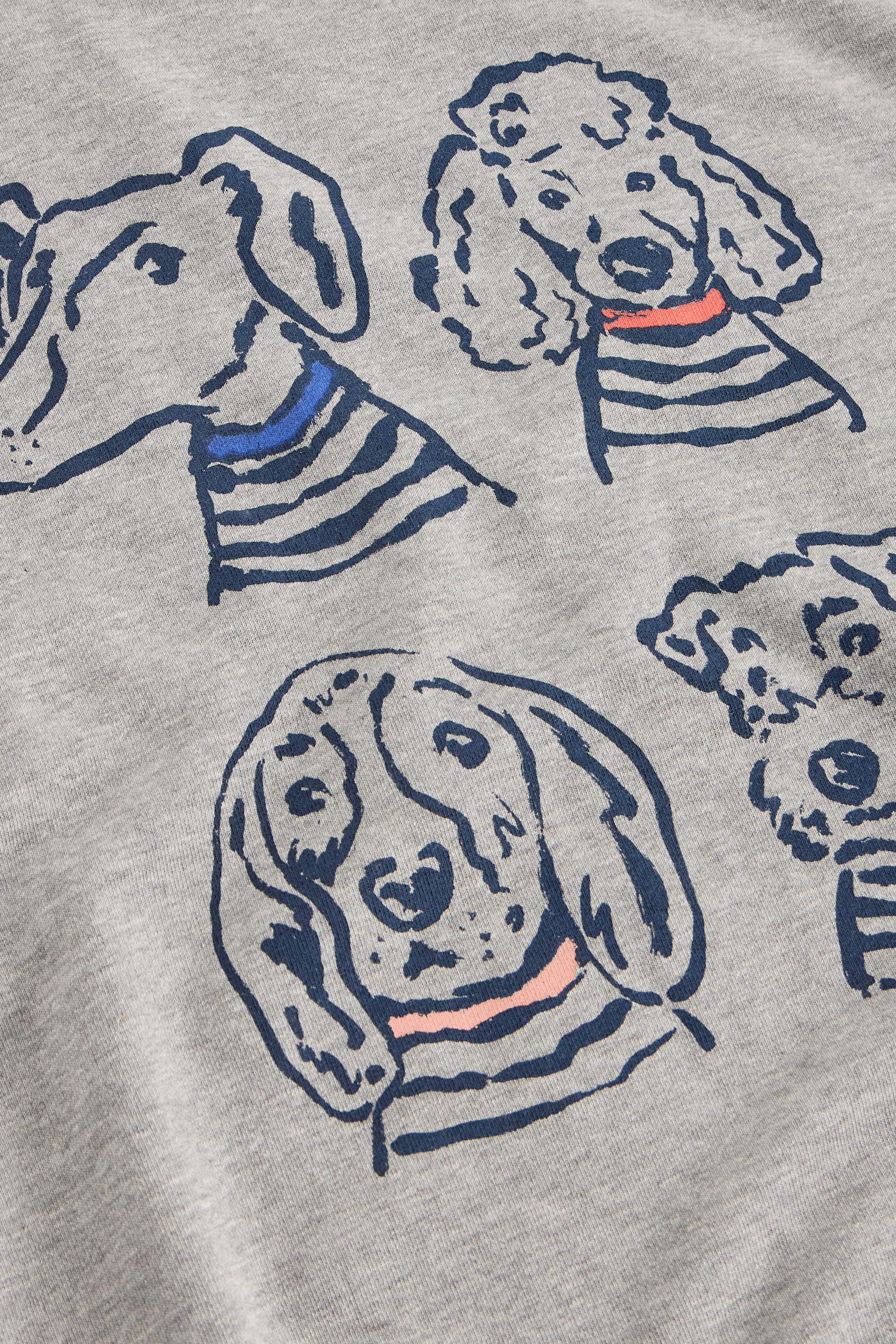 Gray sweatshirt with illustrations of dogs wearing striped shirts on a gray background