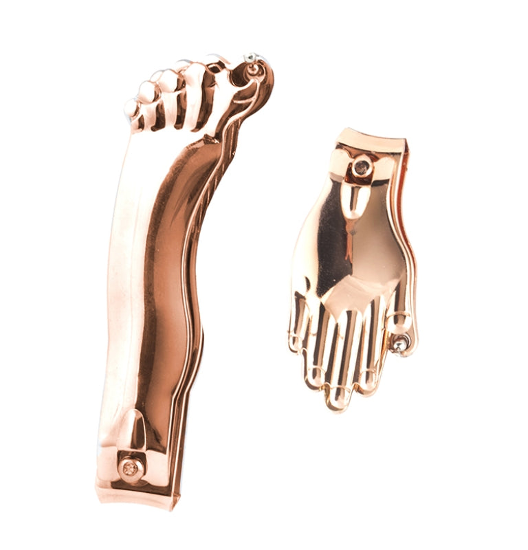 copper foot and hand-shaped earrings on a white background