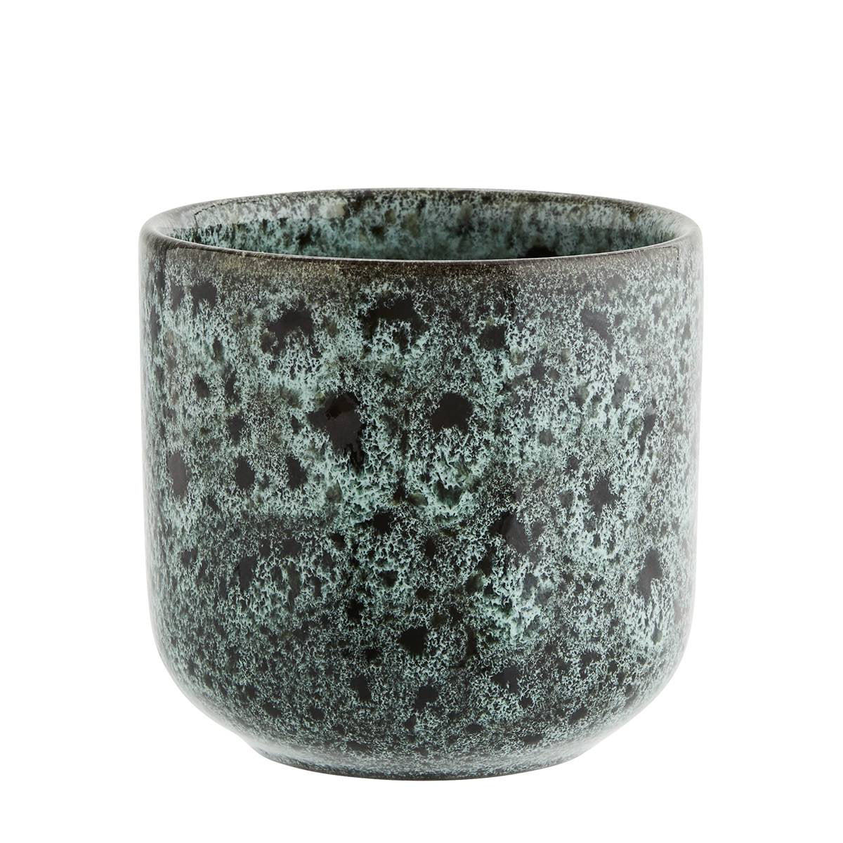 A round ceramic cup with a textured, mottled glaze in shades of dark green, teal, and black, shown against a plain white background.