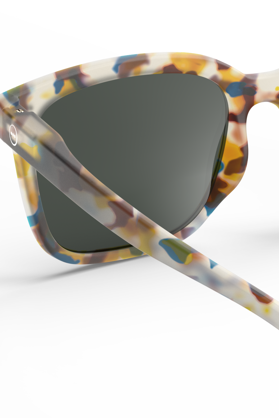 Close-up view of Izipizi sunglasses featuring a colorful mottled tortoiseshell pattern on a white background.