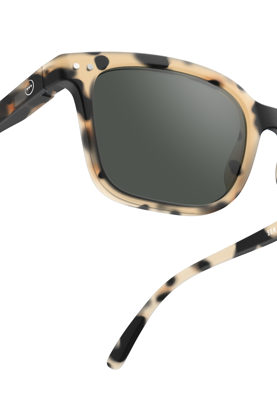 Close-up of Izipizi tortoiseshell pattern sunglasses on a white background.