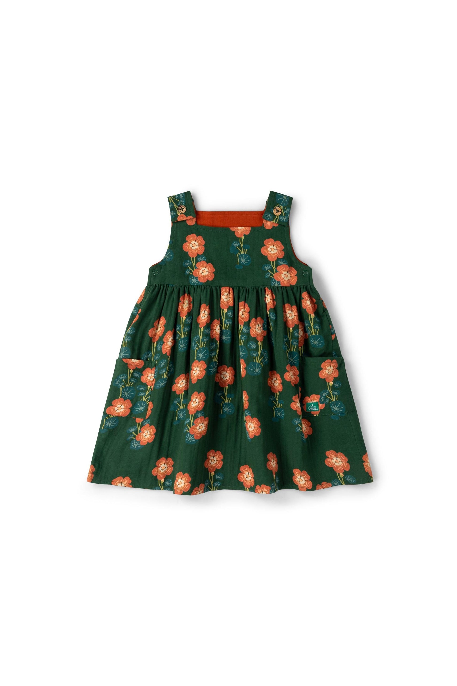 Green reversible dress with floral pattern on a white background