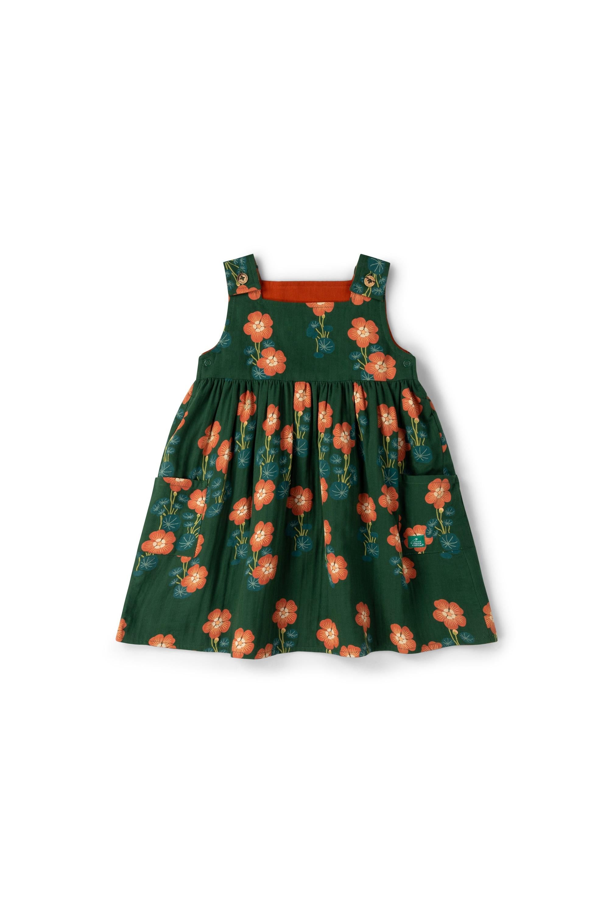 Green reversible dress with floral pattern on a white background