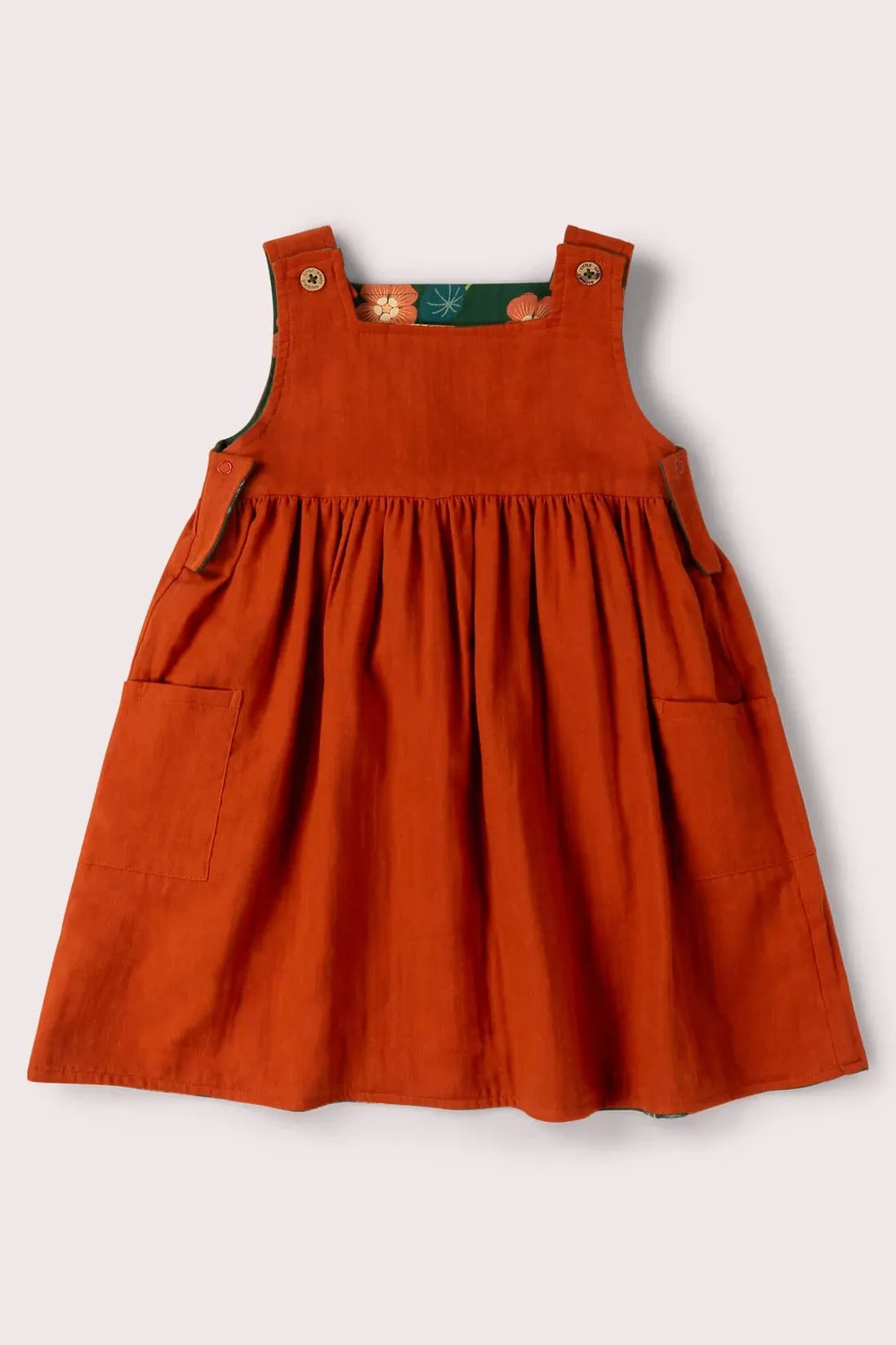 Orange reversible dress on a light gray background