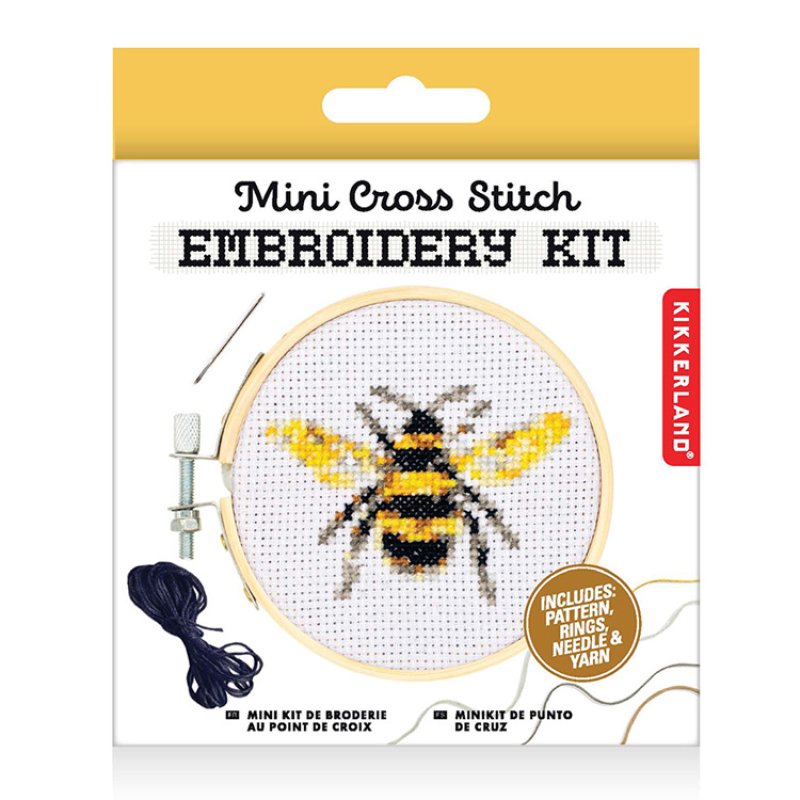Kikkerland mini embroidery kit featuring a bee pattern with hoop, needle, and thread.