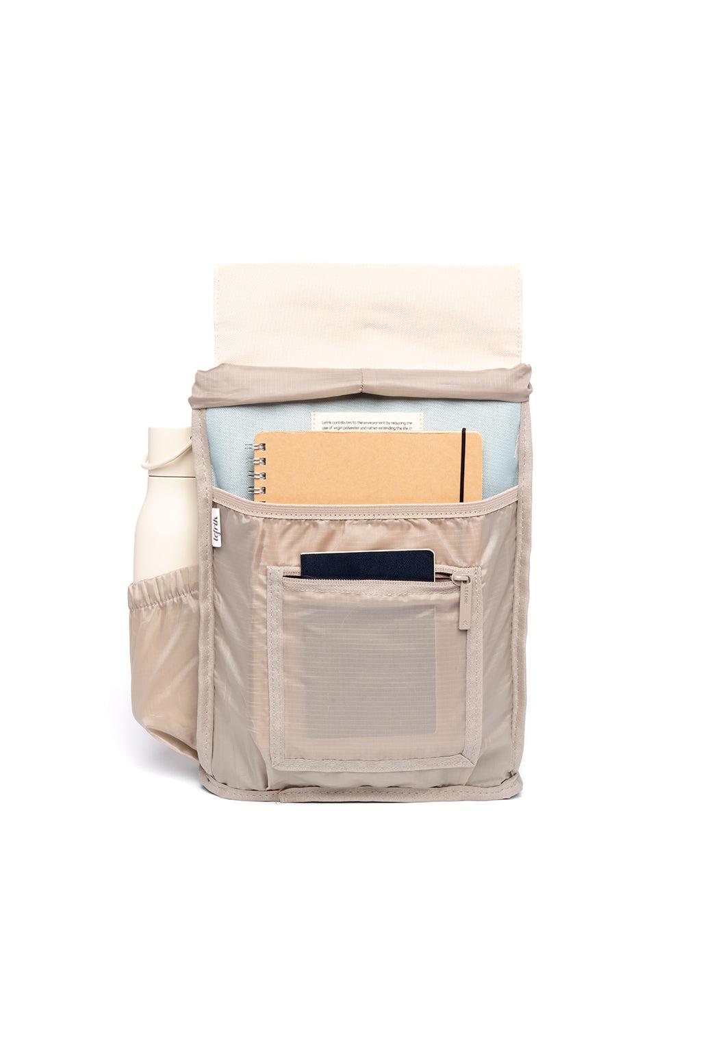 Beige backpack with multiple pockets and compartments on a white background