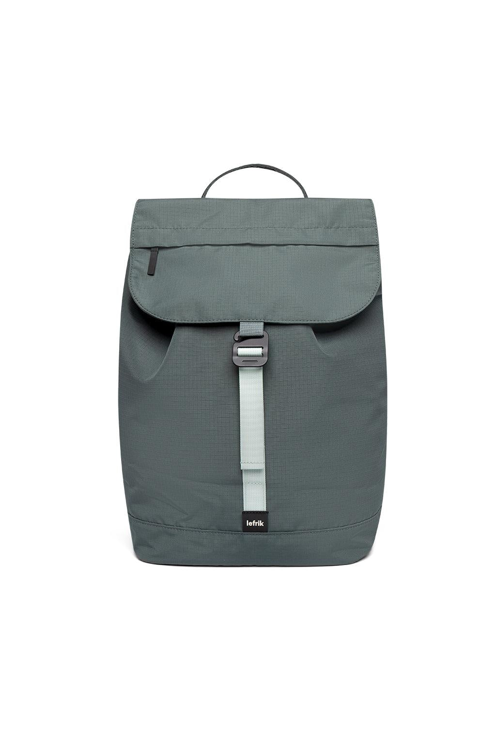 Green backpack with a strap on a white background