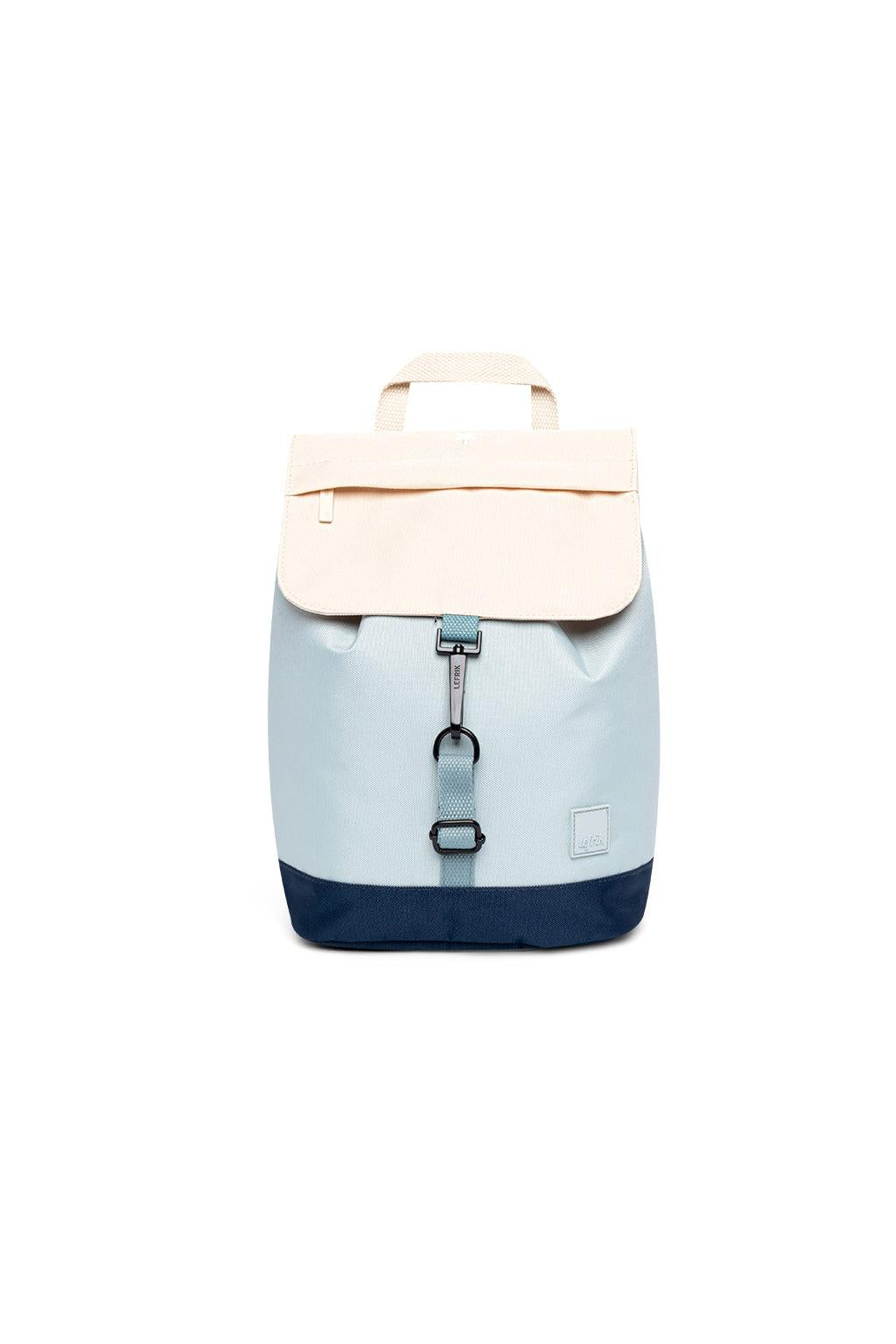 Backpack with beige top section and blue bottom section on a white background