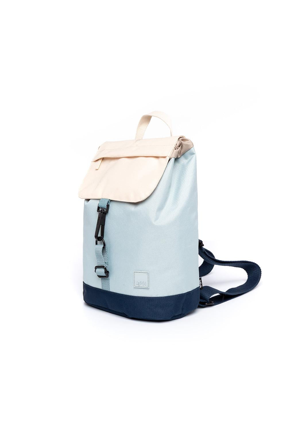 Light blue and navy backpack with beige flap on a white background