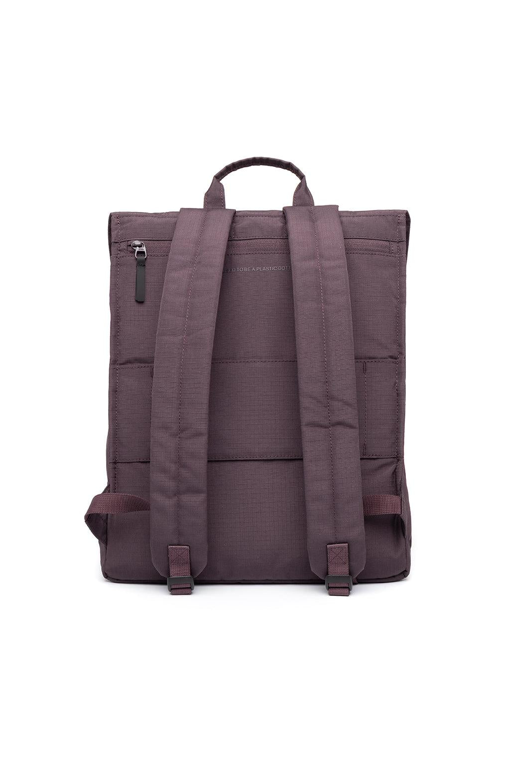 The back view of a dark plum purple backpack, featuring padded shoulder straps, a top carry handle, and multiple zippered pockets, set against a plain white background.