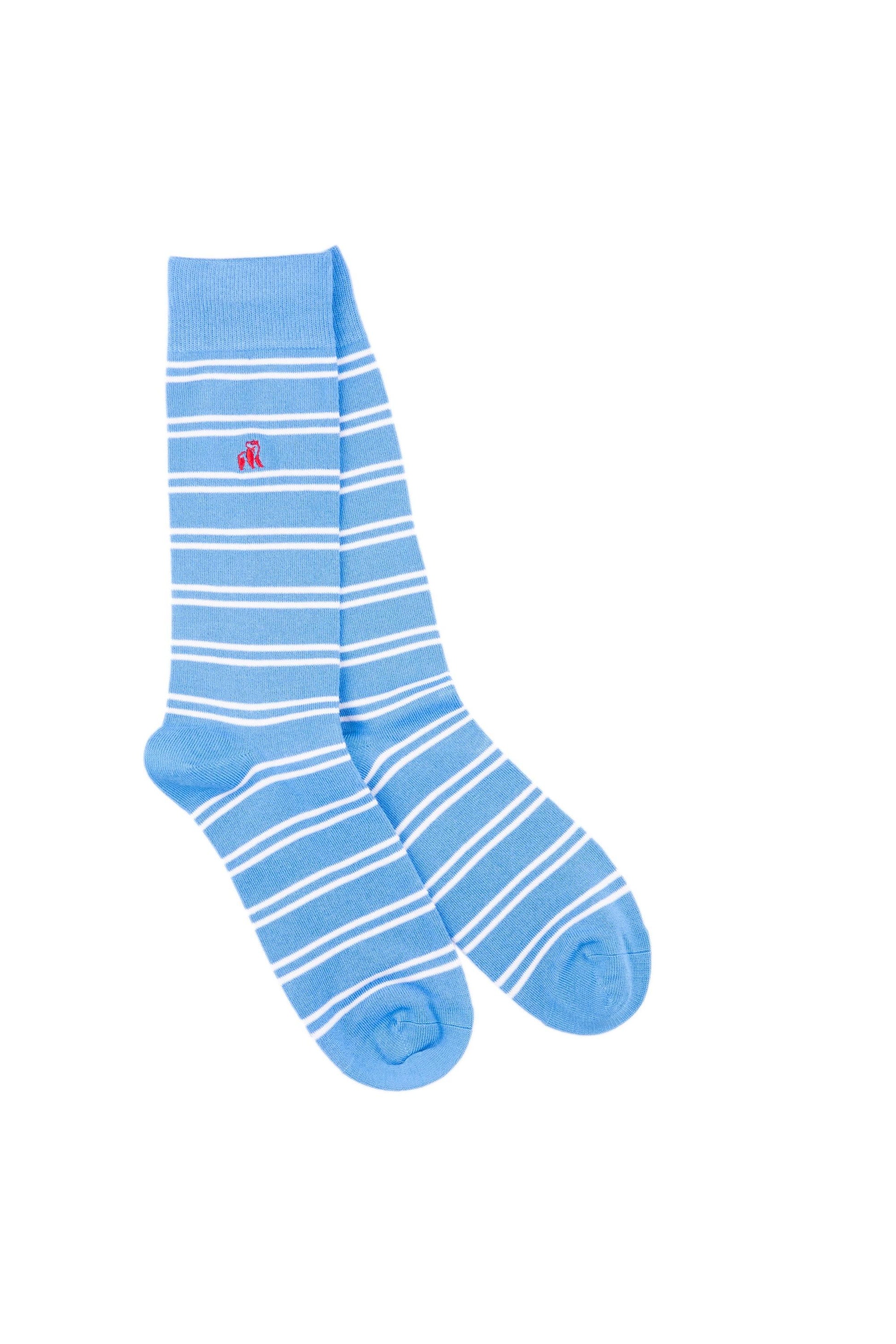 A pair of light blue crew socks with white horizontal stripes and a small red logo embroidery.