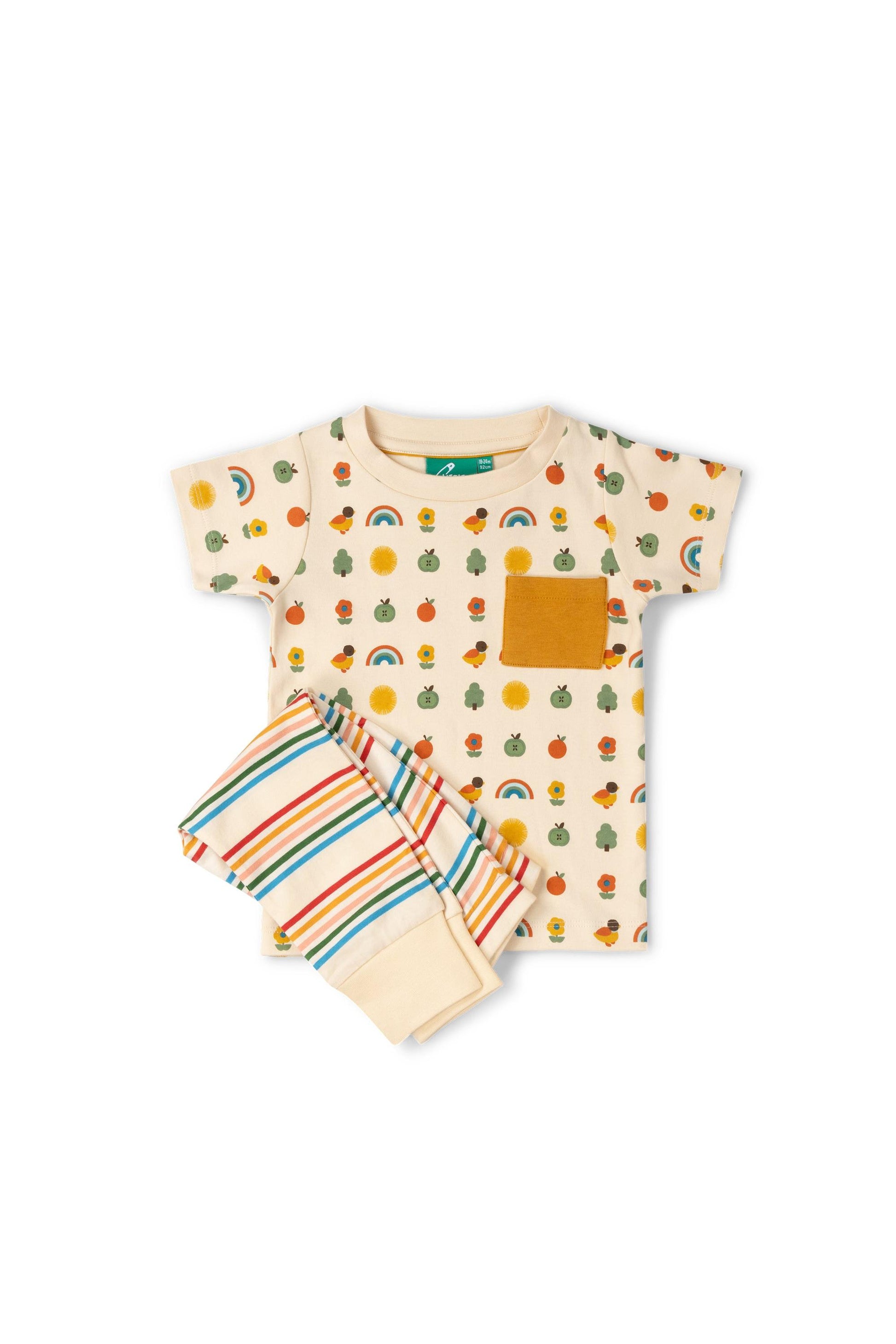 Children's outfit with t-shirt and shorts featuring fruit and rainbow patterns on a white background