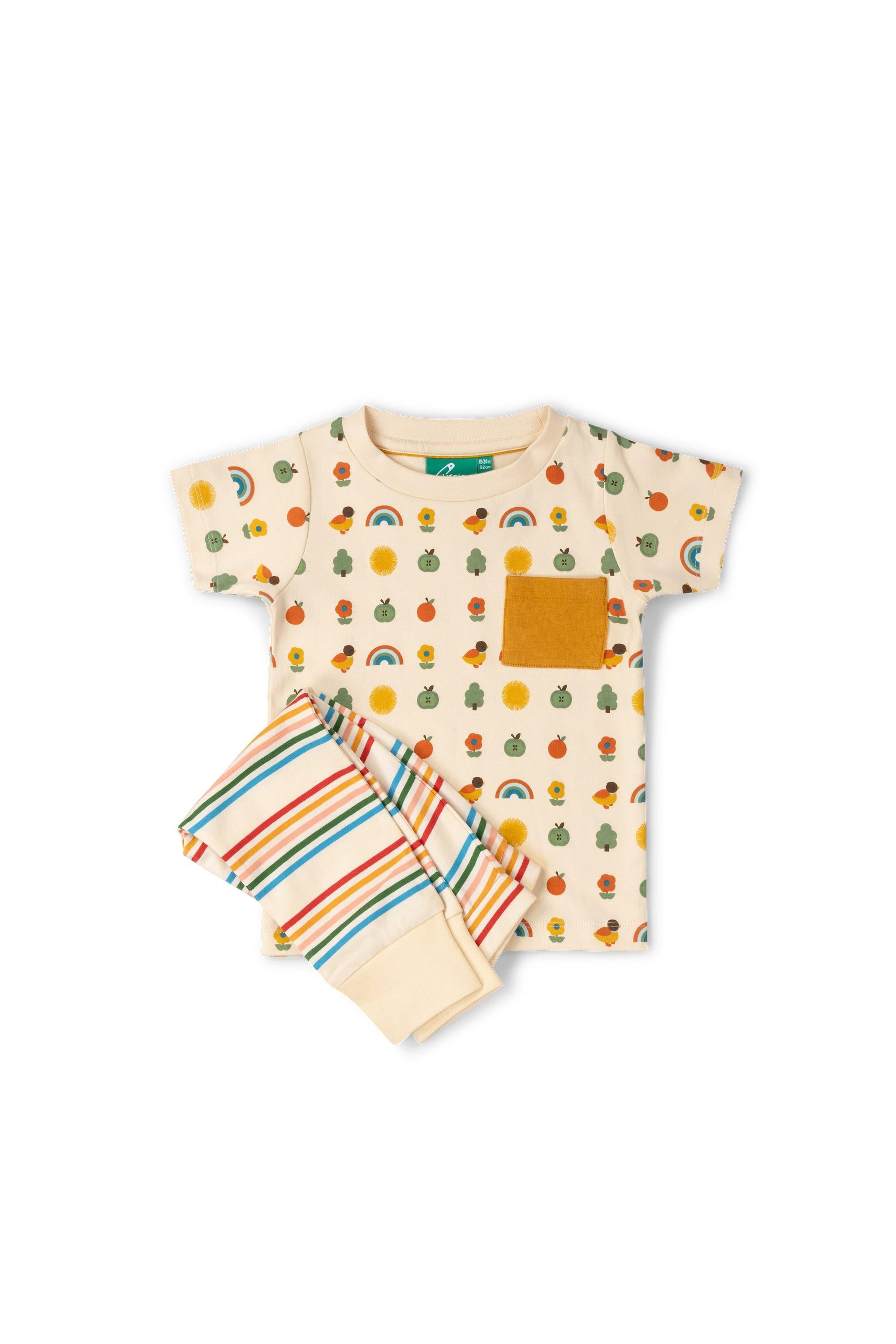 Children's outfit with t-shirt and shorts featuring fruit and rainbow patterns on a white background
