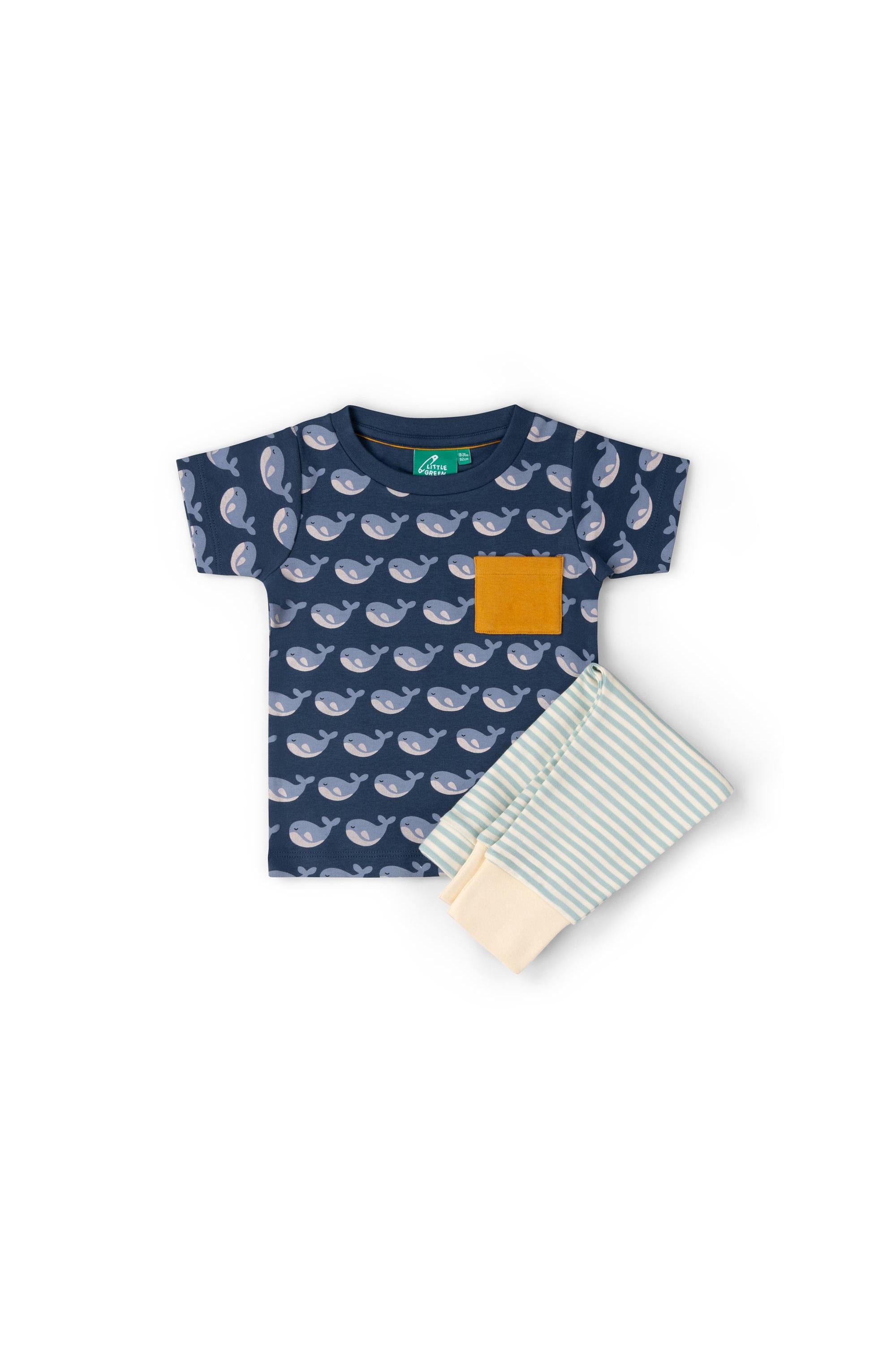 Children's navy blue shirt with whale pattern and striped pants on a white background