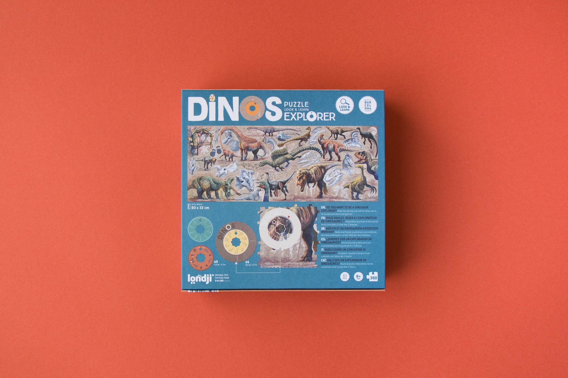 Dinos puzzle explorer packaging on an orange background