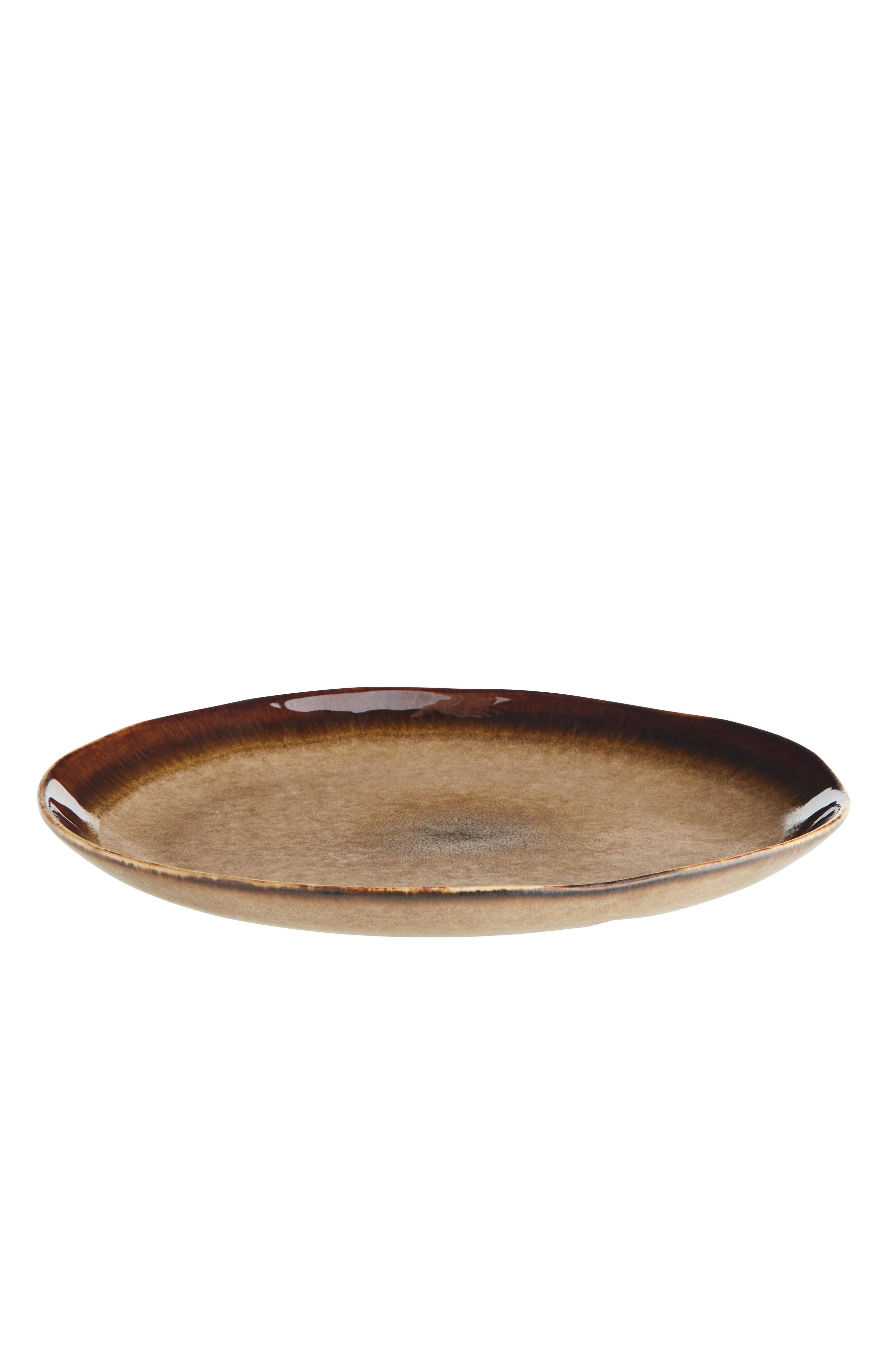 Brown ceramic plate on a white background