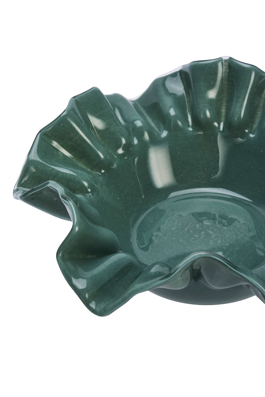Green ceramic bowl with scalloped edge on a white background