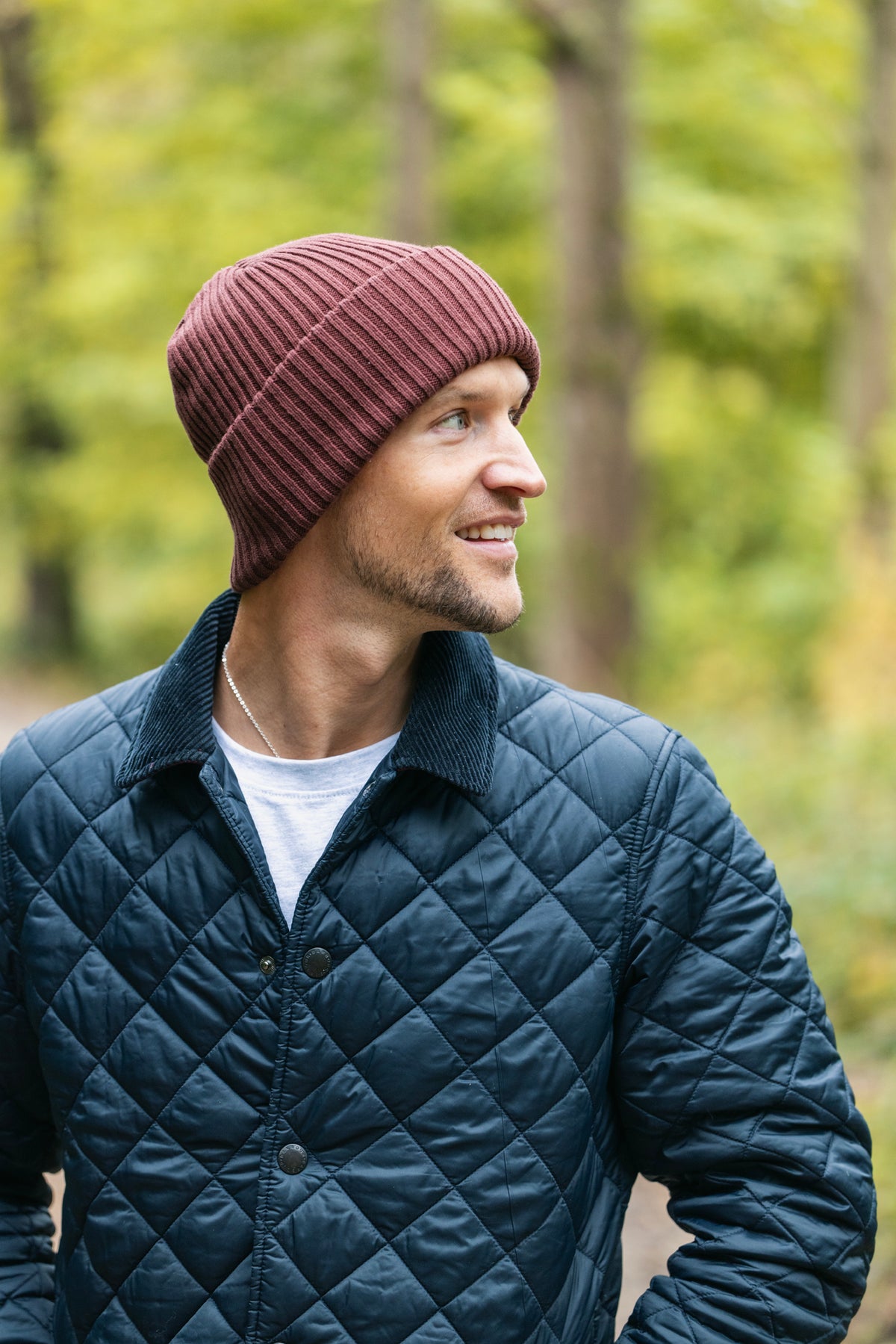 A Swole Panda men's beanie hat in a burgundy colour, made with organic cotton