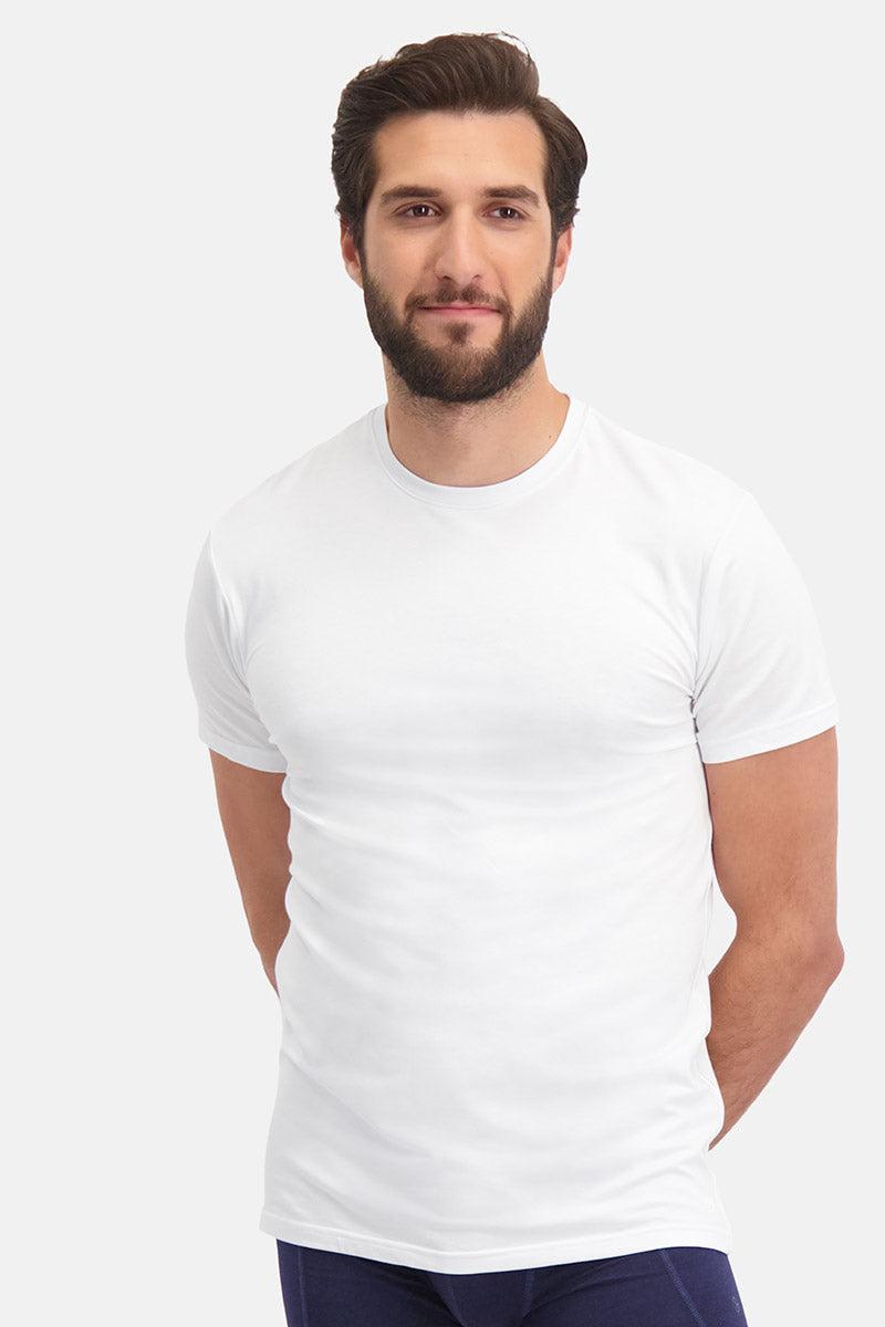 A bearded man wearing a clean white bamboo fiber t-shirt standing against a white background