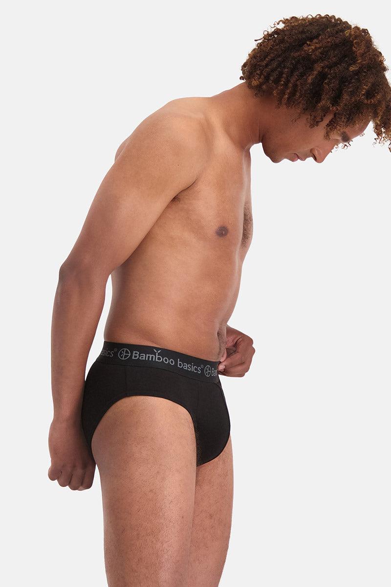 Man wearing black bamboo underwear on a white background