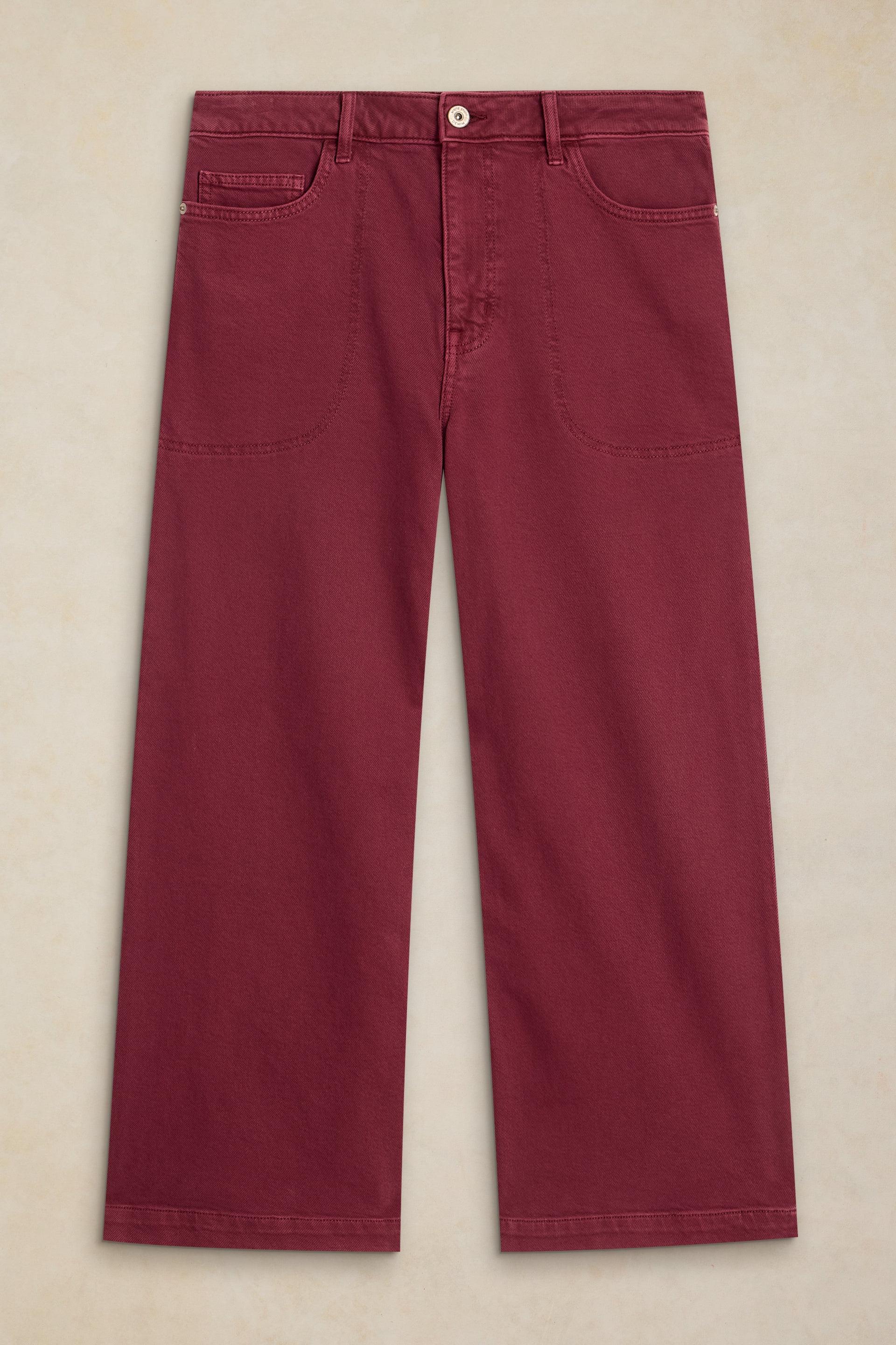 Front view of maroon wide-leg trousers made from organic cotton on a neutral background.