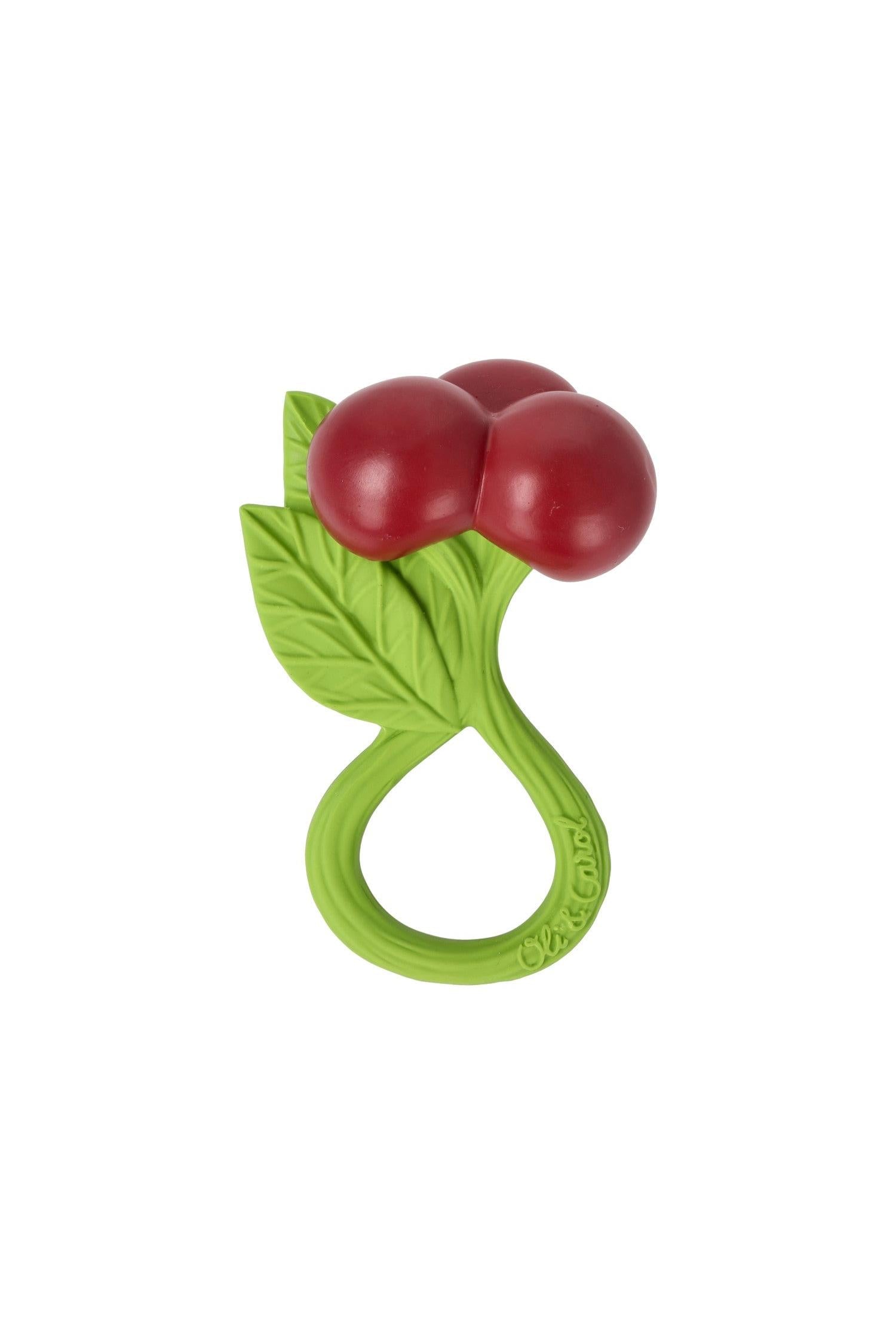 Natural teething ring with red berries and green leaves on a white background