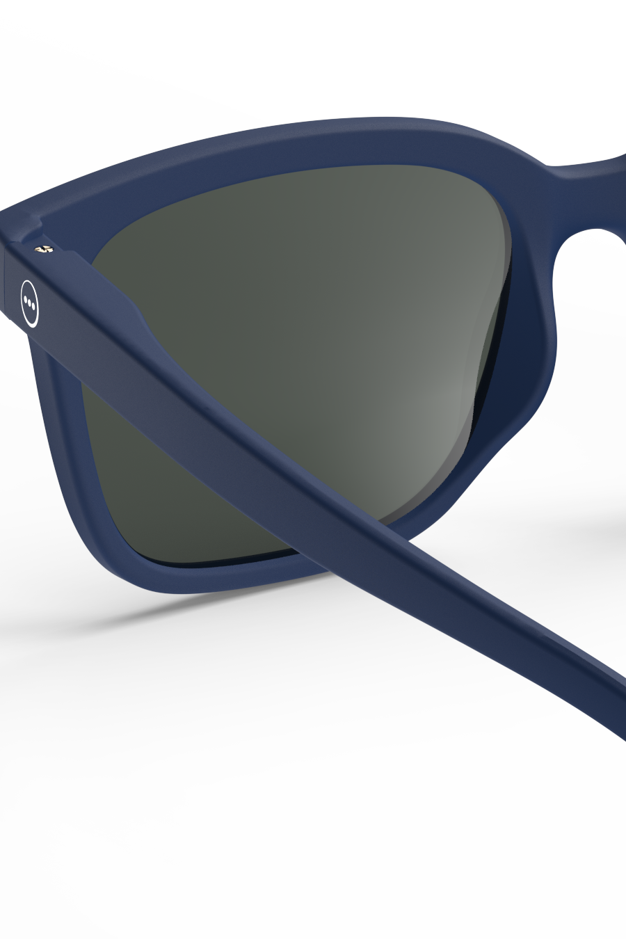 Close-up of navy blue Izipizi sunglasses with a matte finish against a white background.