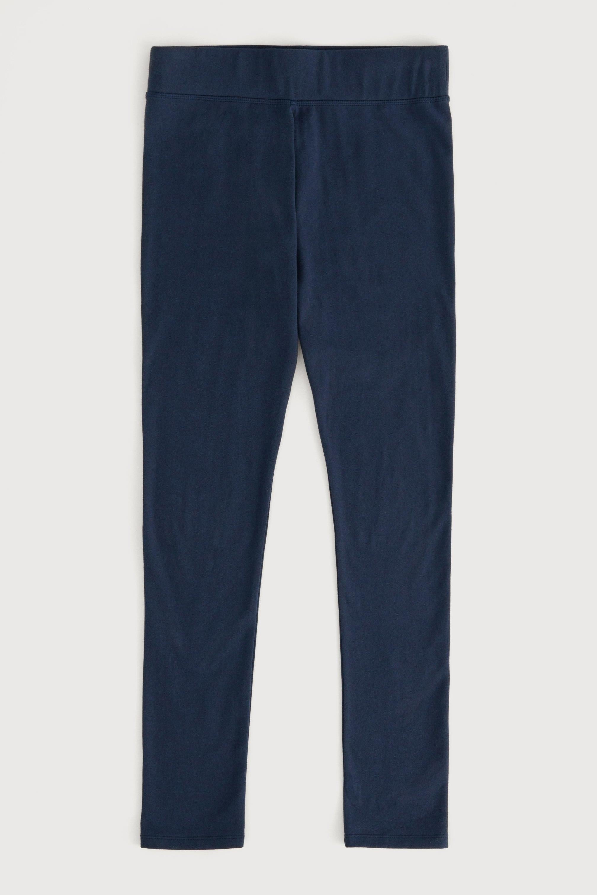 A pair of organic cotton navy blue leggings shown flat against a light gray background.