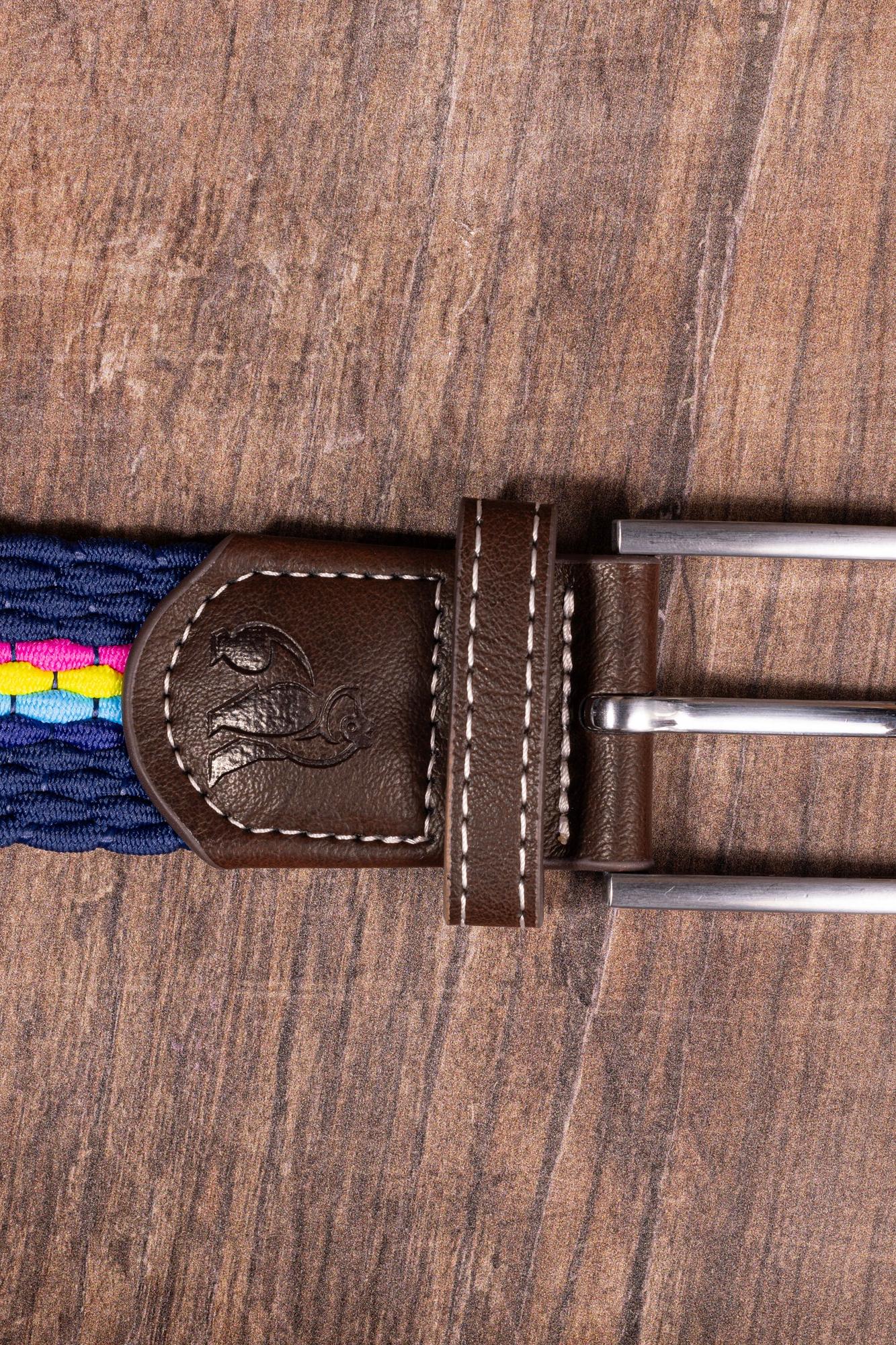 A navy blue woven belt with multicolor accents and a leather buckle resting on a wooden surface.