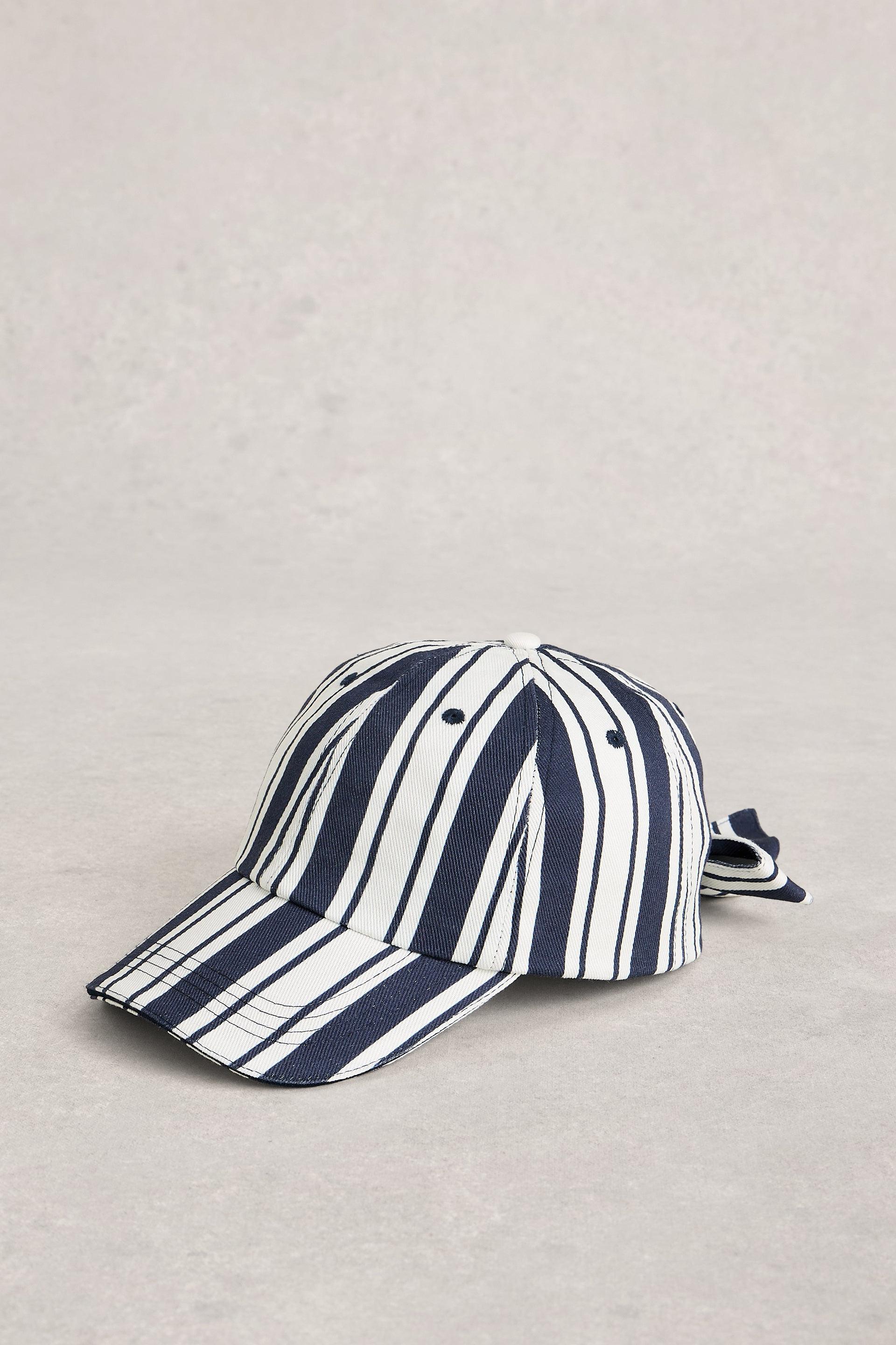 Navy and white striped baseball cap on a grey background