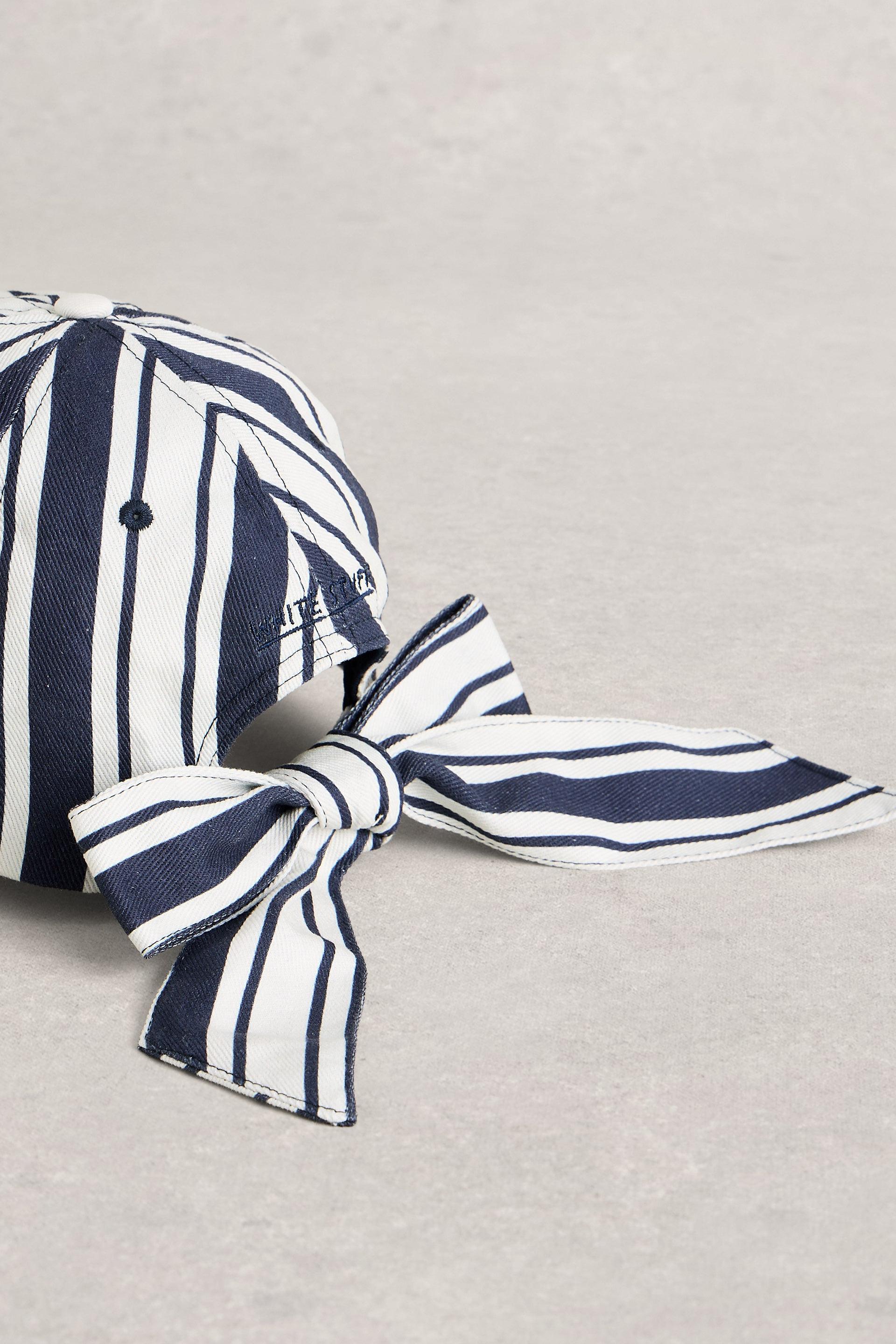 Baseball cap with a bow and navy and white stripes