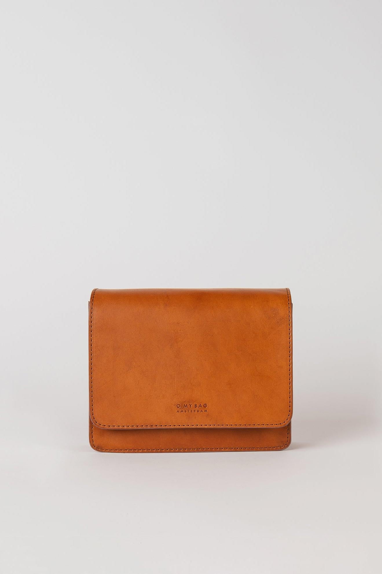 Brown leather wallet on a light gray background